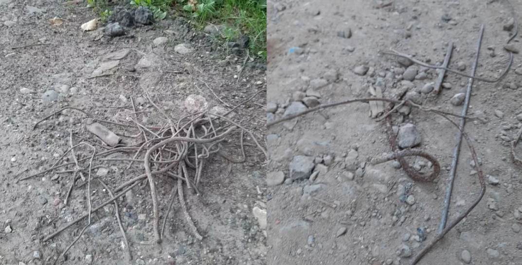 В Дзержинском районе дорогу подсыпали строительным мусором с остатками острой арматуры — местные жители убирали двое суток
